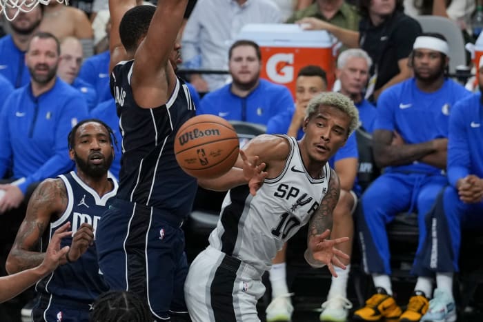 Oct 25, 2023; San Antonio, Texas, USA; San Antonio Spurs forward Jeremy Sochan (10) passes around Dallas Mavericks forward Grant Williams (3) in the second half at the Frost Bank Center.
